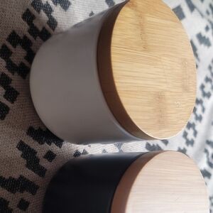 White and Black Ceramic Jars with Wooden Lids